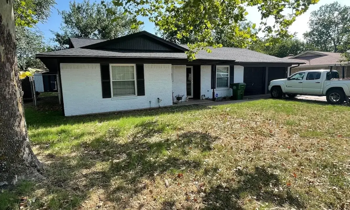Professional roofing crew working on a residential roof in Bigfork